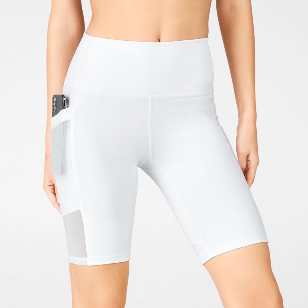 Fabletics On-the-Go High Waisted 9” Biker Short in white (S)